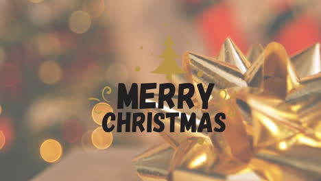 animación de la pancarta de texto de feliz navidad contra el primer plano de la decoración de la cinta dorada