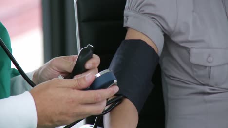 doctor checking the blood pressure