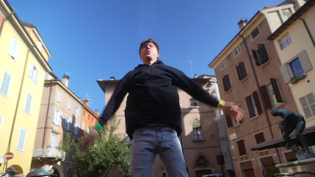 Man Dancing in a European Square