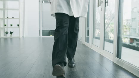 doctor walking in hospital corridor