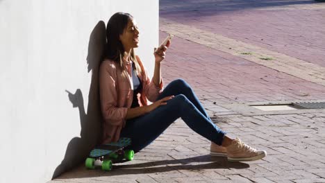 Woman-talking-on-mobile-phone-during-sunny-day-4k