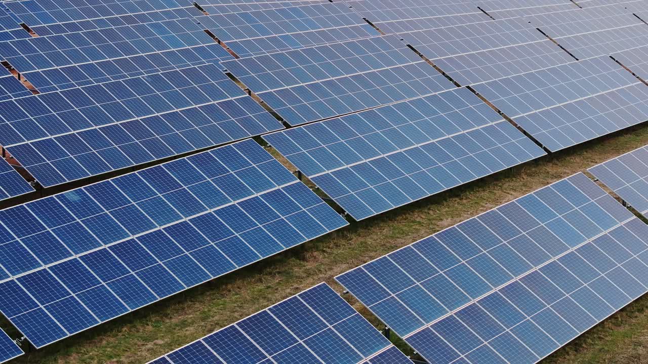 Solar panels stretch into distance, renewable revolution has already begun, 4K