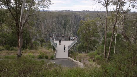 hand held shot of people on the viewing platform at wollomombi falls, oxley wild rivers national park, new south wales, australia