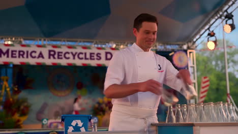 chef promoting recycling with glass bottles