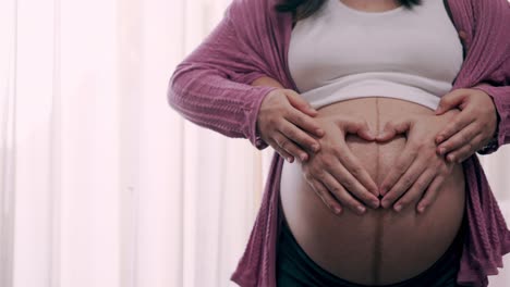 Pregnant-couple-feels-love-and-relax-at-home.