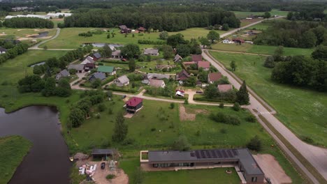 An-aerial-view-of-Livi-city,-highlighting-its-green-spaces-and-extensive-cycle-paths-next-to-the-main-road