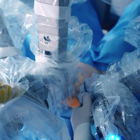 modern medical equipment during surgery. robotic arms of surgical device perform a microsurgery in clinic. close-up.