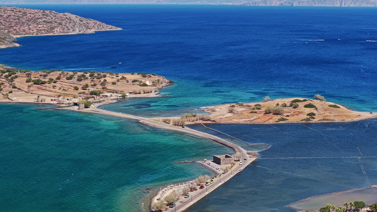 High angle view of the causeway, windmills, and Aegean Sea at Elounda, Crete