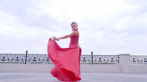 woman dancing in a red dress
