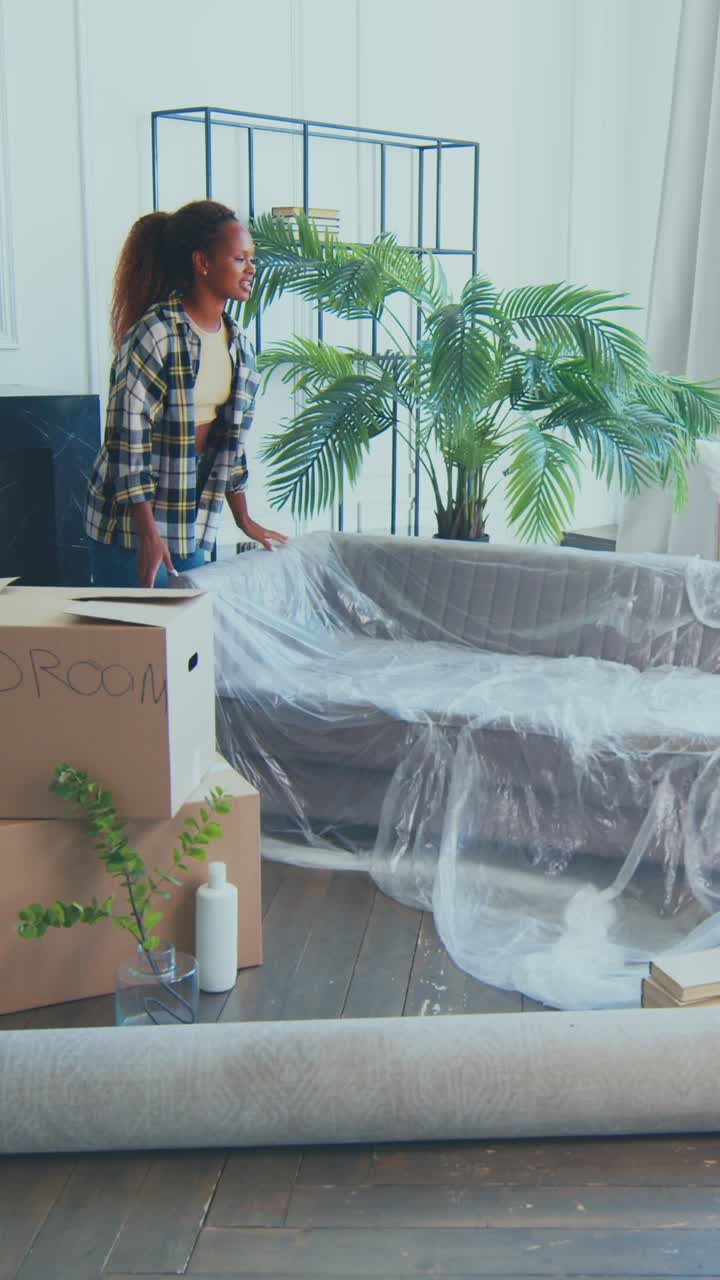 Diverse couple moves into their new home filled with excitement and charm