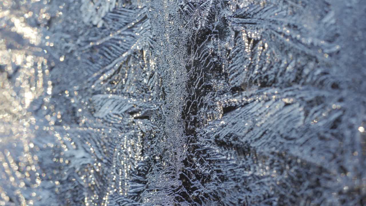 Macro Shot Of Snowflakes Frozen On A Glass Surface