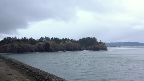 Drone-flying-towards-Cape-Disappointment-Lighthouse-in-Washington-State,-USA