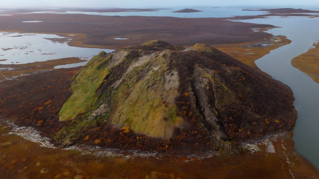 A Picturesque View of Pingo Landmark, a Famous Geographical Feature Located Near the Community of Tuktoyaktuk in the Northwest Territories (NWT), Canada - Orbit Drone Shot
