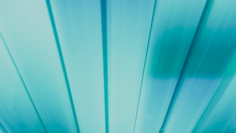 close up shot of flickering light blue ultraviolet lamps of tanning bed in solarium