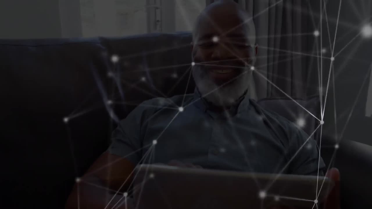 Animation of networks of connections with icons over man using tablet