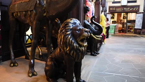 statues and people in a dubai market