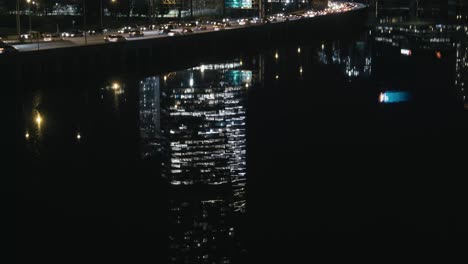 philadelphia's fmc building at night, reflected in the schuykill river