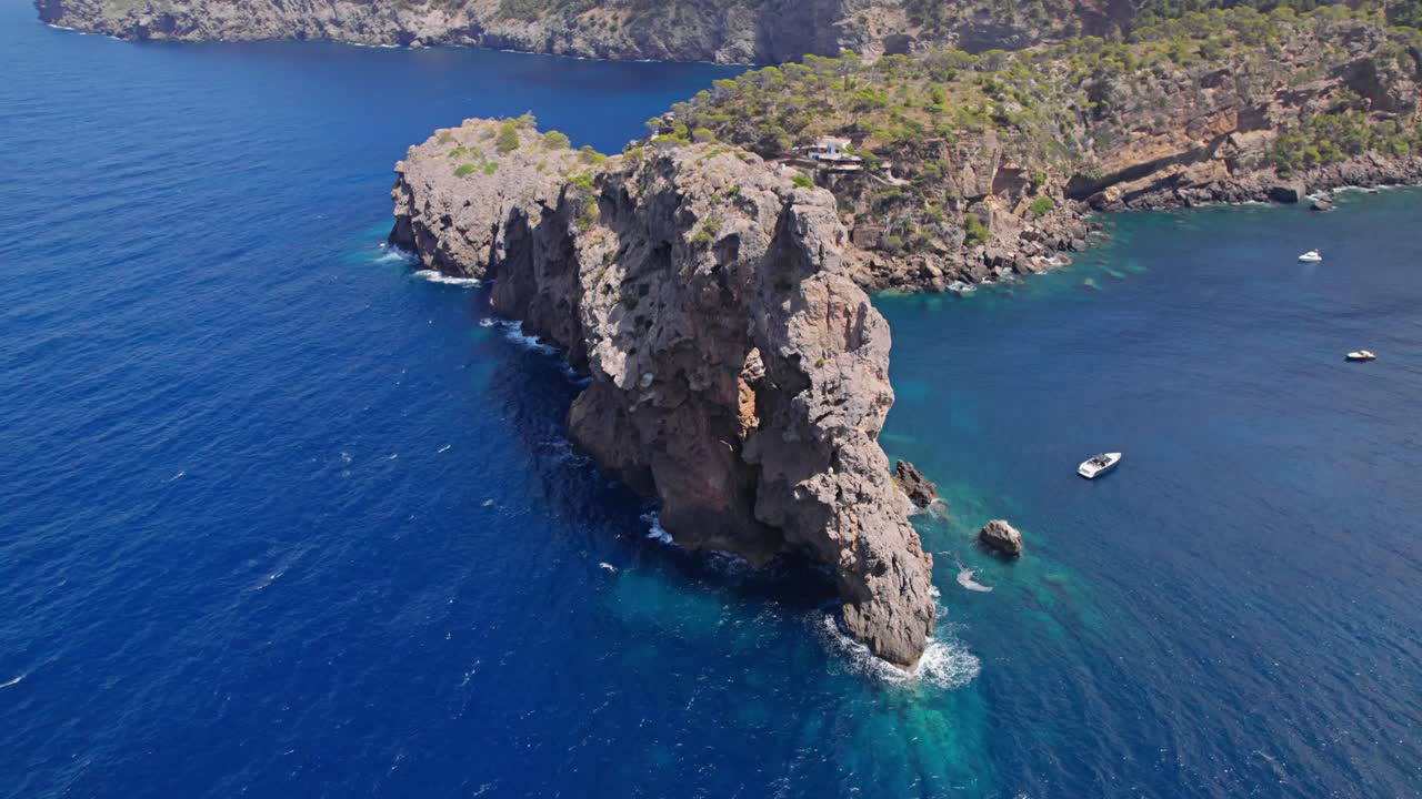 Drone shot of a rough cliff cove with yacht´s anchor