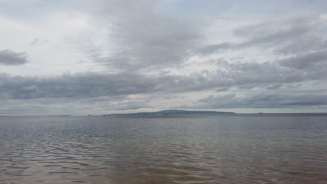 Nusa-Lembongan-Island-View-Bali-Indonesia-from-the-Sea-of-Sanur-Beach-Blue-Water-Afternoon-Semi-Cloudy-Sky,-the-Bluest-Vision