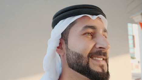 close up of bearded arab wearing ghutra kandura