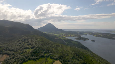 Cone-shaped-Jendemsfjellet-mountain-next-to-Haroy-fjord,-Norway