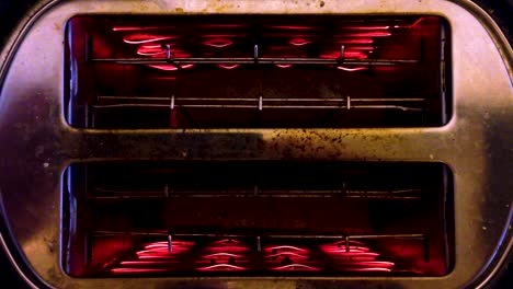 old toaster from above toasting bread