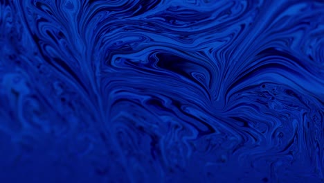 blue wavy streaks and swirls: macro shot from liquid soap