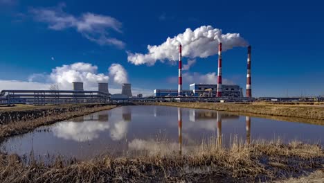 polish coal-fired plant carbon dioxide exhaust fumes come out of smokestack