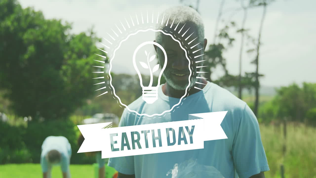 Earth Day light bulb animation over people cleaning up park