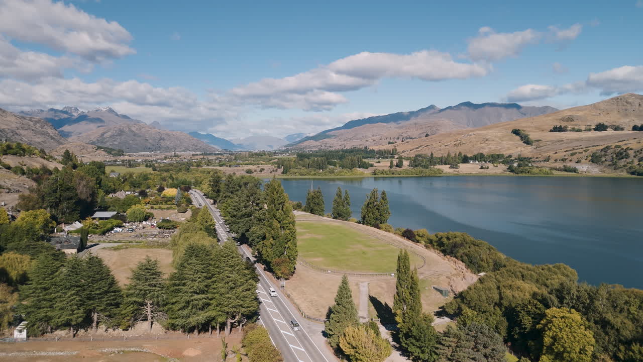Aerial View of a Scenic Lake and Mountain Valley in New Zealand