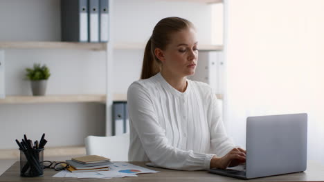 woman working on laptop in office