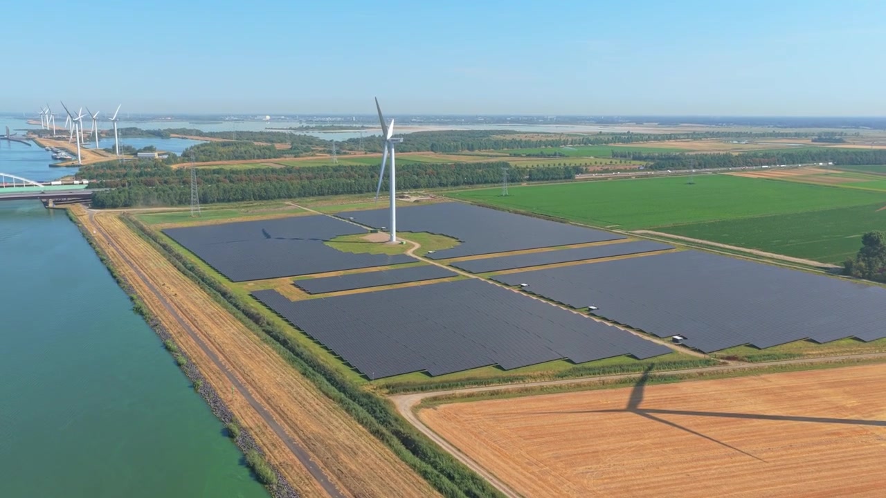 Aerial View of Wind Turbines and Solar Panels in Rural Landscape