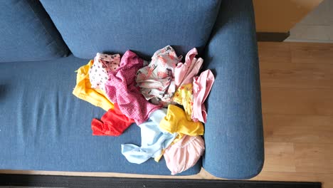 pile of clothes on a couch