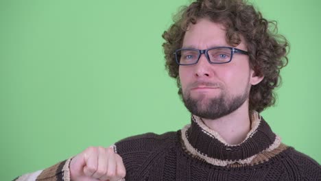 young handsome bearded man with curly hair