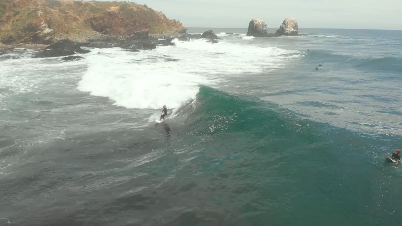 Girl paddling and catching wave on a sunny day at Punta de Lobos, Pichilemu-4K