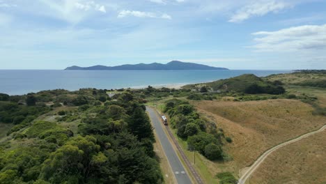 a shot of an old tram traveling towards the coast