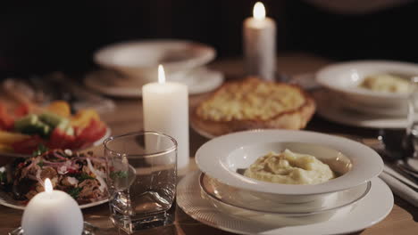 the soup is placed on a plate. festively served table