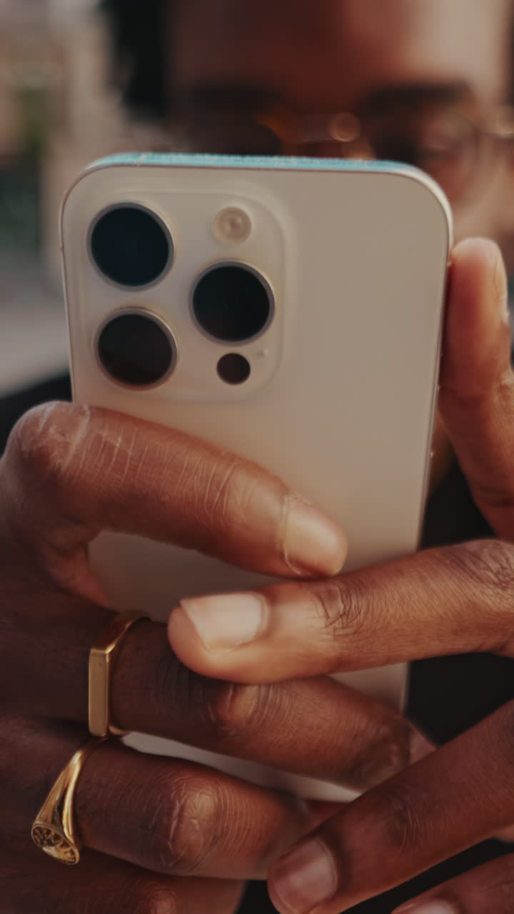 Close-up of Person's Hands Holding a Modern Smartphone