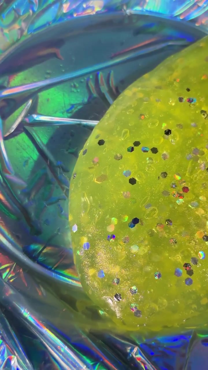 Glitter slime toy with holographic background