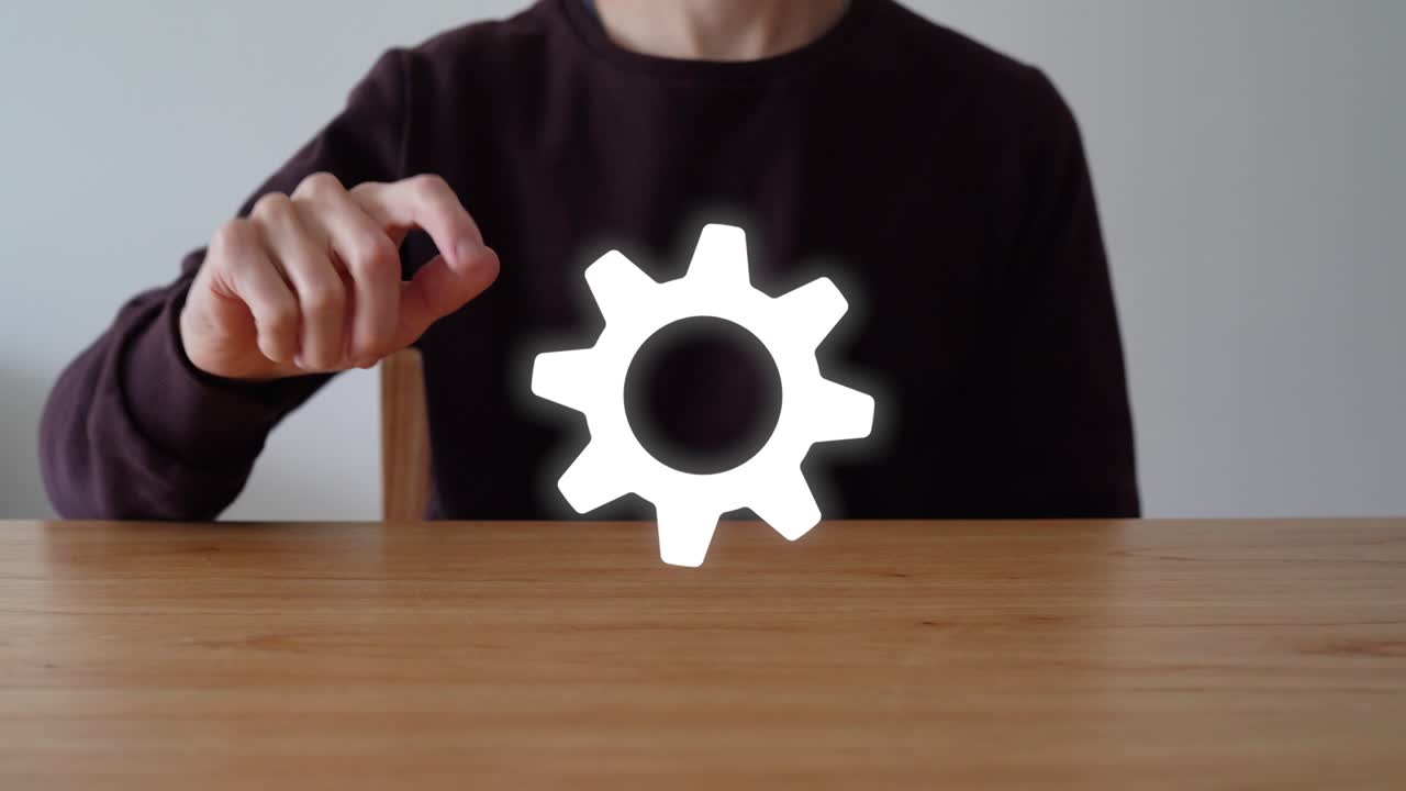 Person Sitting On Wooden Table Touch The Gear Concept of Configuration. - close up shot