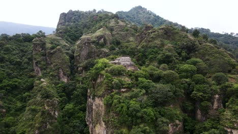 dolly out shot of tepoztlan's pyramid in morelos mexico