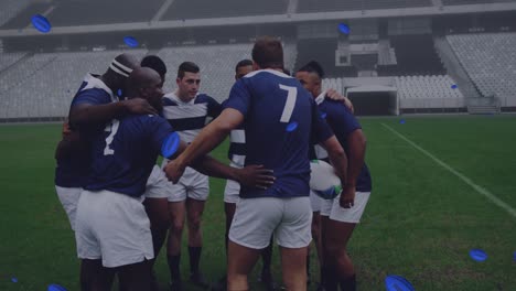 animation of rugby balls with uruguay text over diverse male rugby players at stadium