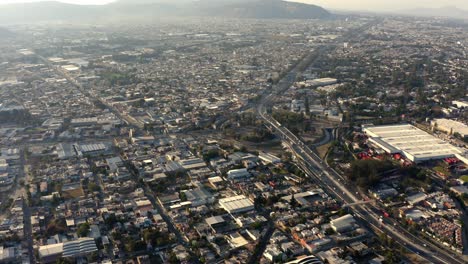 drone : orbit of a road clover in guadalajara jalisco at sunset