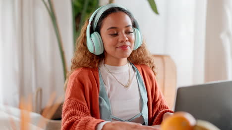 woman working from home while listening to music