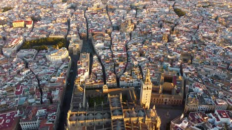 catedral de sevilla. drone shot of the beautiful spanish city of seville at the sunrise, uhd, 4k