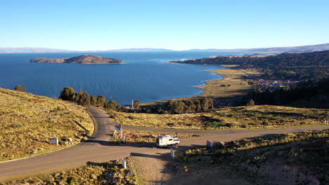 tracking rv expedition truck golden hour titicaca lake bolivian side overlander