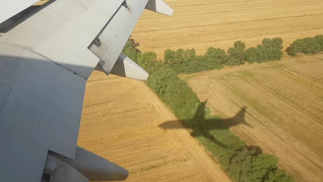 jet airplane landing shadow on the ground