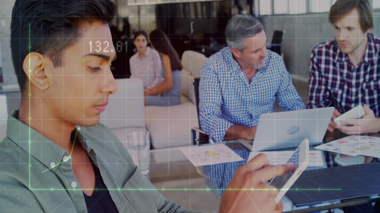 Male colleague tapping tablet and initiating real-time data chart animation in business meeting