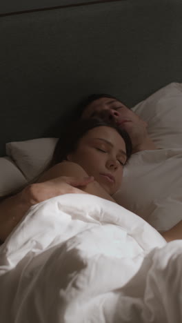 couple sleeping in bed