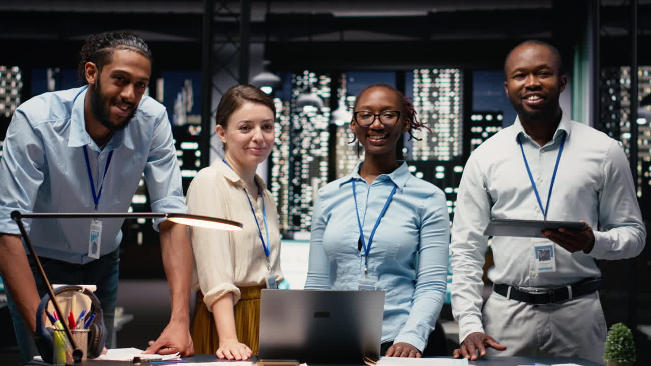 Diverse coworkers portrait, working late in office, collaborating on strategy